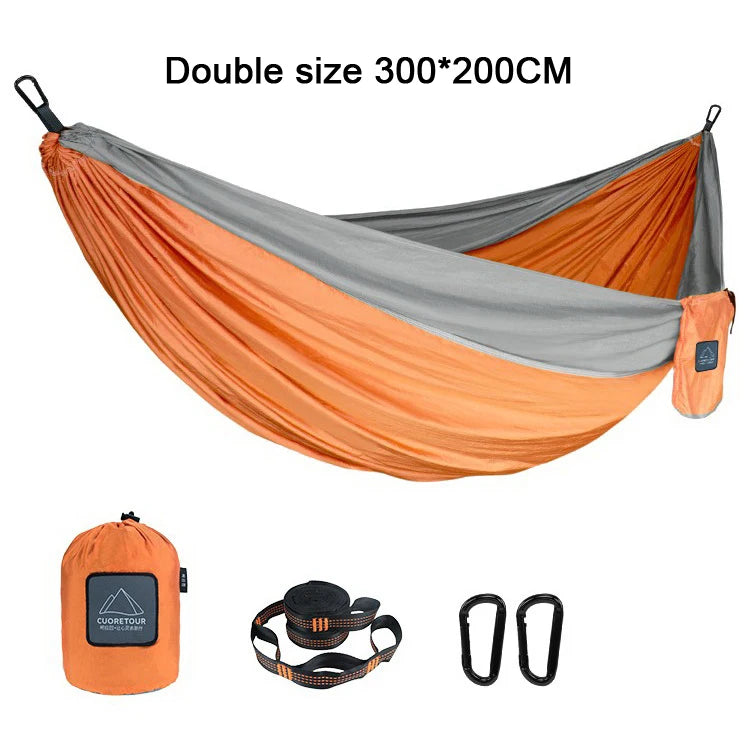 Portable Nylon Parachute Fabric Hammock in outdoor setting, showcasing its lightweight and comfortable design.