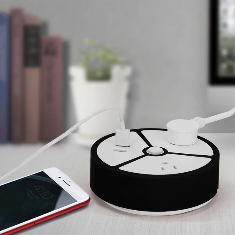 Power Packed Portable Outlet USB Power and AC Extension Socket with a sleek black and white design, featuring a neatly wound cable and multiple charging ports.