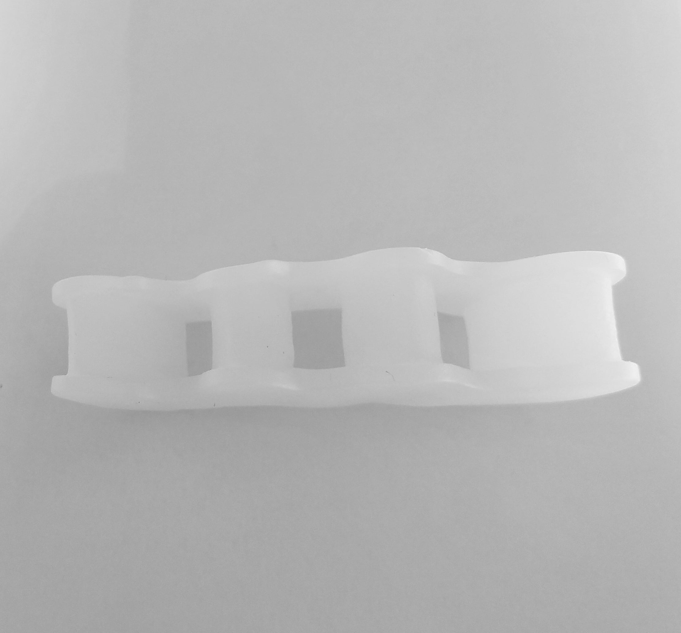 A pair of Premium Toe Spacers made from soft silicone gel, designed for toe alignment and comfort.