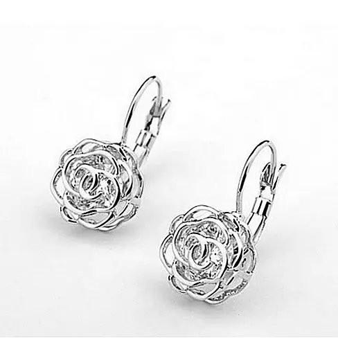 Elegant ROSE IS A ROSE 18kt Rose Crystal Earrings featuring diamond crystals in rose, white, and yellow gold finishes.