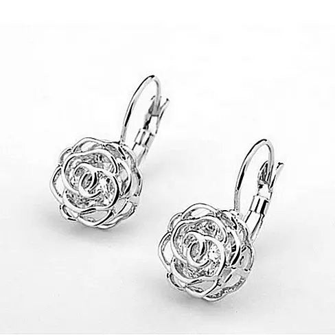 Elegant ROSE IS A ROSE 18kt Rose Crystal Earrings featuring diamond crystals in rose, white, and yellow gold finishes.