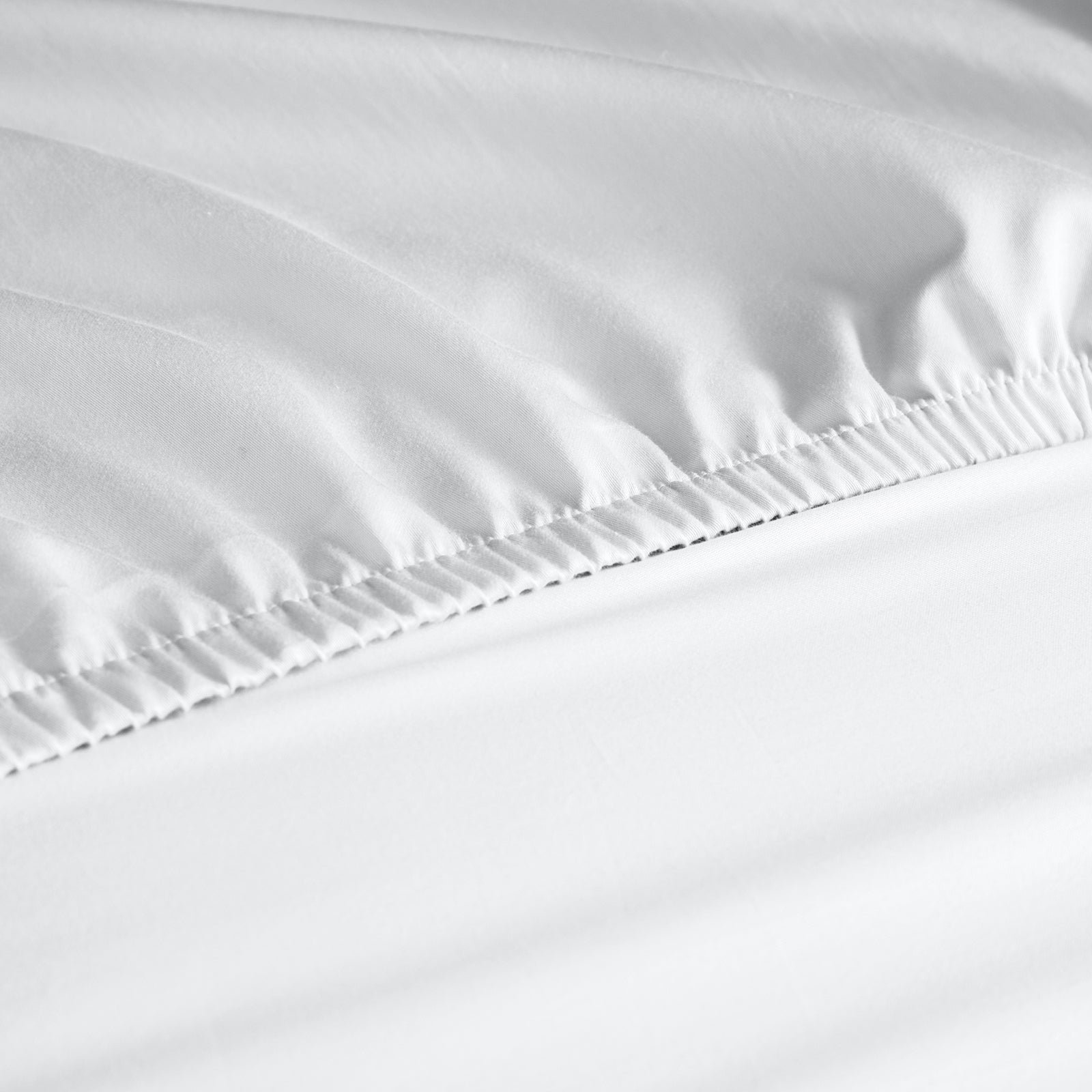 Royal Comfort 1000 Thread Count Fitted Sheet in various colors, showcasing its luxurious texture and quality.