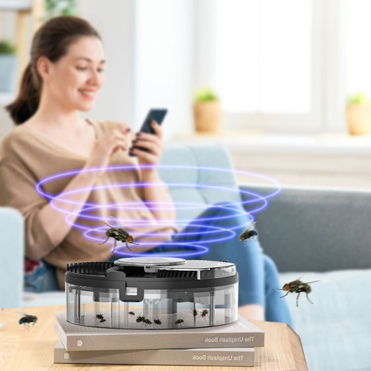 S008 Automatic Fly Killer Silent USB Household Fly Trap in a modern kitchen setting, showcasing its compact design and USB charging feature.