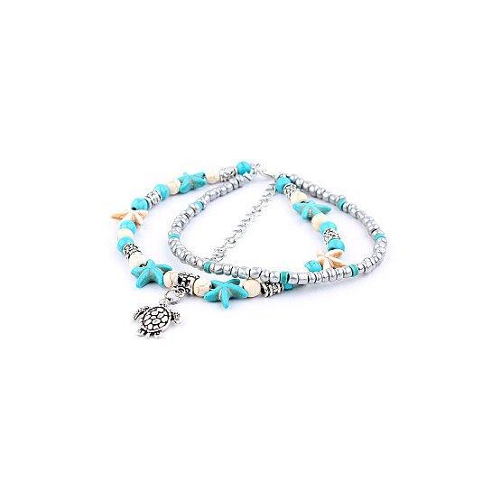 A beautiful Sea Turtle Anklet featuring turquoise and white Hematite beads with a white gold-plated chain and Sea Turtle charm.