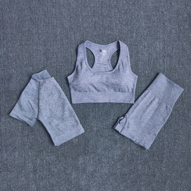 Seamless 3pcs Women Yoga Set featuring a crop top, workout bra, and high-waisted shorts in various colors.