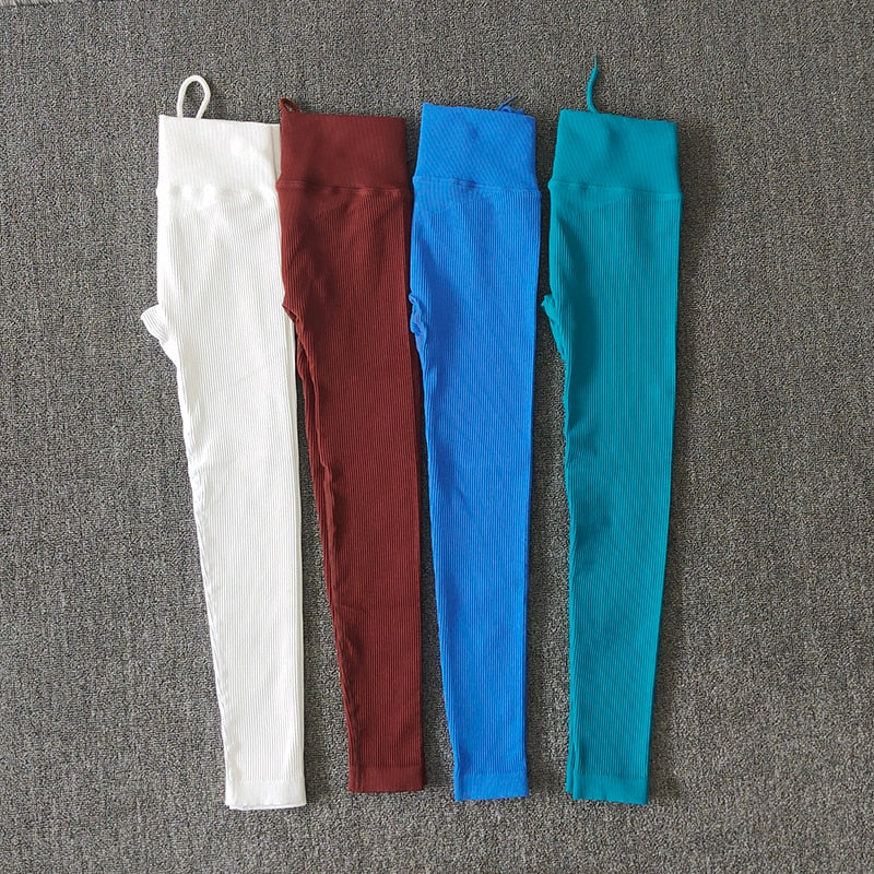 A pair of seamless solid color yoga pants for women, showcasing a high waist design and available in various colors.