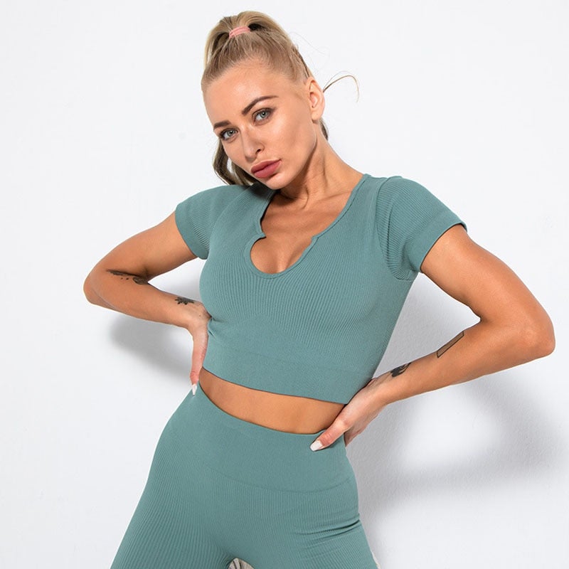 A stylish Seamless Yoga Shirt Deep V-Neck for women, featuring short sleeves and available in multiple colors, perfect for workouts and casual wear.