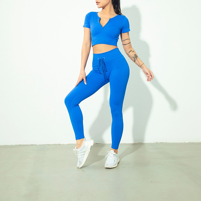 Seamless Zipper Women Yoga Set featuring a stylish crop top and high waist leggings in various colors, perfect for workouts and yoga.