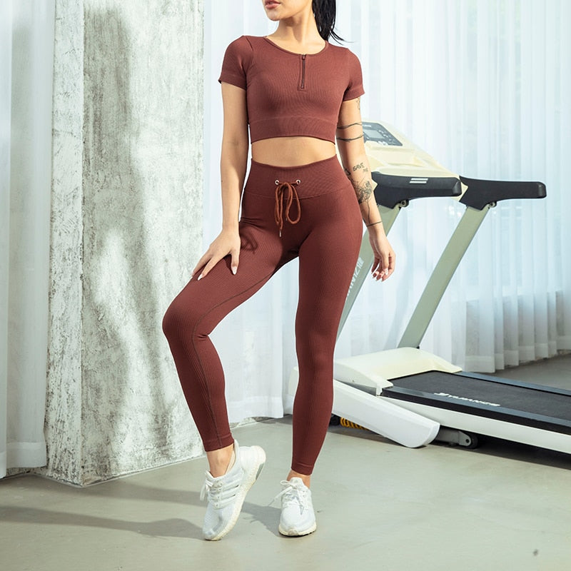 Seamless Zipper Women Yoga Set featuring a stylish crop top and high waist leggings in various colors, perfect for workouts and yoga.