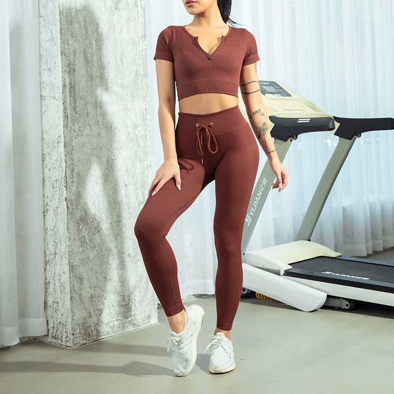 Seamless Zipper Women Yoga Set featuring a stylish crop top and high waist leggings in various colors, perfect for workouts and yoga.