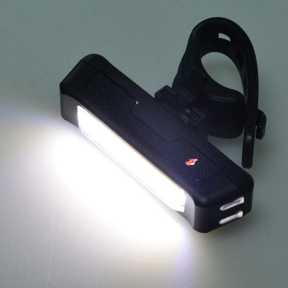 USB rechargeable LED bike light set including front headlight and rear taillight with silicone mounting straps.