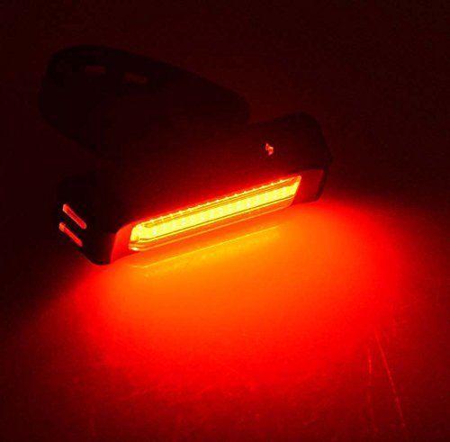 USB rechargeable LED bike light set including front headlight and rear taillight with silicone mounting straps.