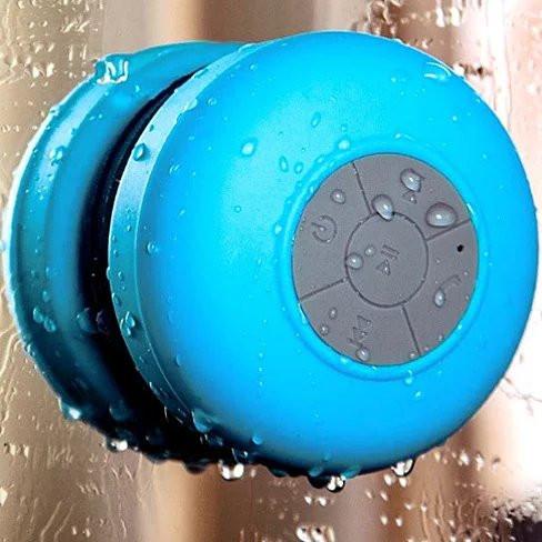 A vibrant Bluetooth speaker designed for use in the shower, featuring a waterproof silicone exterior and built-in microphone for hands-free calls.