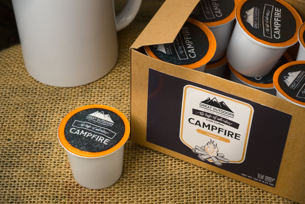 A collection of 48 single serve coffee pods in various flavors, neatly arranged in a box, showcasing the Sunrise, Morning Bite, Double Barrel, and Campfire blends.