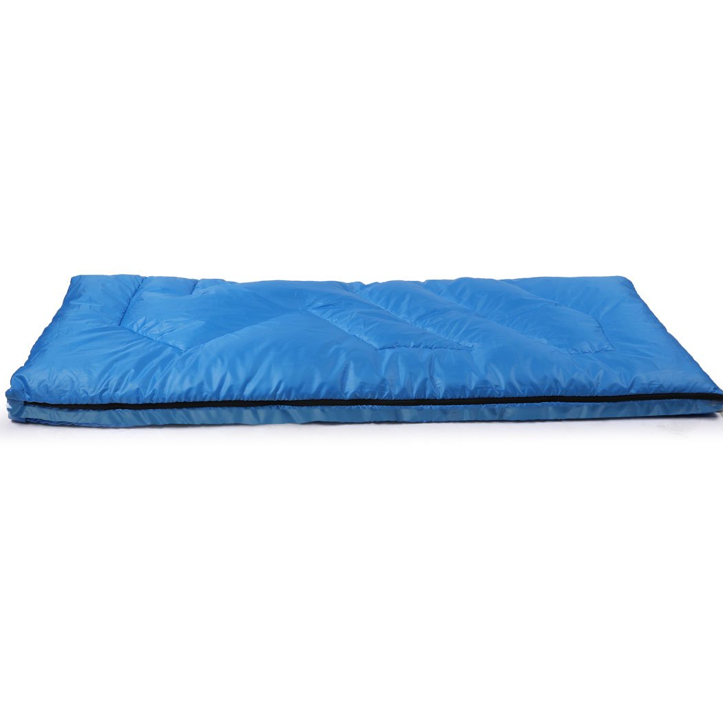 Blue sleeping bag designed for outdoor camping and hiking, featuring a water-repellent exterior and comfortable hollow cotton filling.