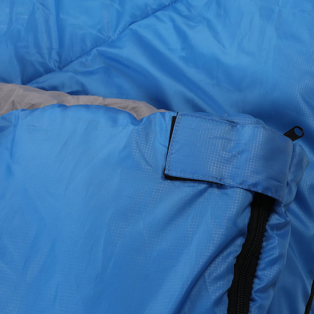 Blue sleeping bag designed for outdoor camping and hiking, featuring a water-repellent exterior and comfortable hollow cotton filling.