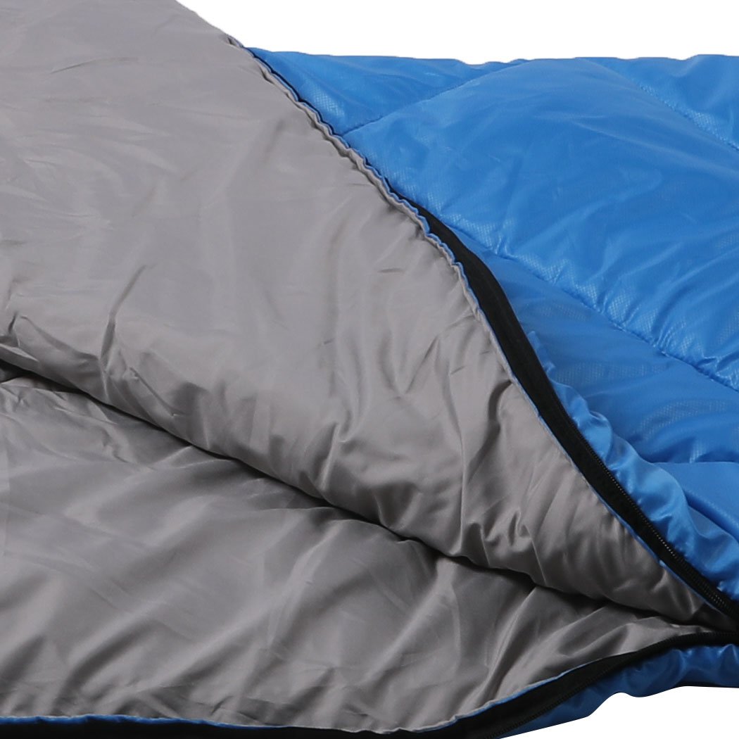 Blue sleeping bag designed for outdoor camping and hiking, featuring a water-repellent exterior and comfortable hollow cotton filling.