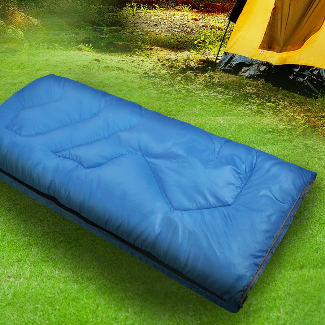 Blue sleeping bag designed for outdoor camping and hiking, featuring a water-repellent exterior and comfortable hollow cotton filling.