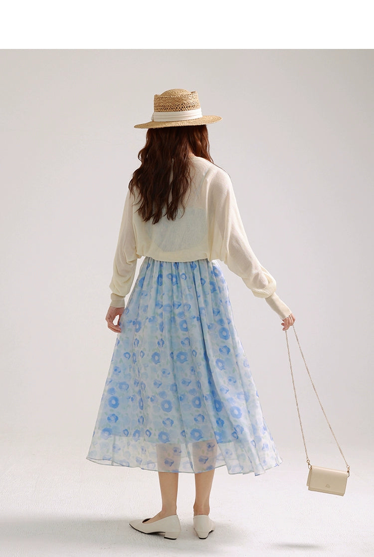 A charming blue suspender skirt featuring a playful bunny print, perfect for summer wear.