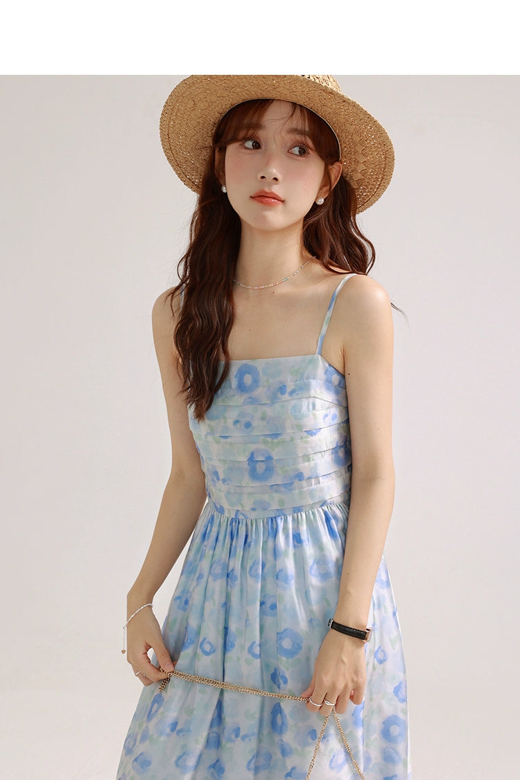 A charming blue suspender skirt featuring a playful bunny print, perfect for summer wear.