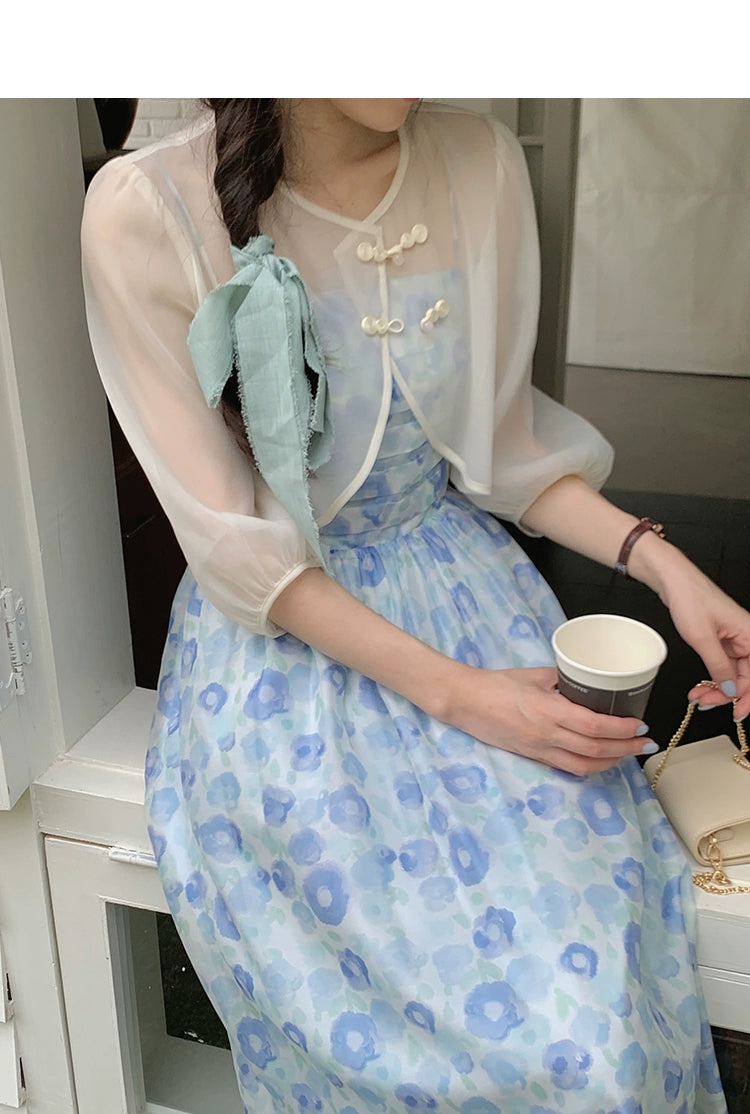 A charming blue suspender skirt featuring a playful bunny print, perfect for summer wear.