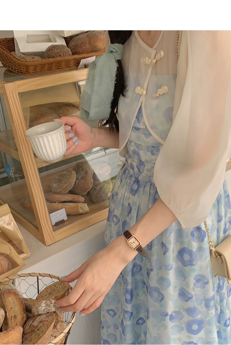 A charming blue suspender skirt featuring a playful bunny print, perfect for summer wear.