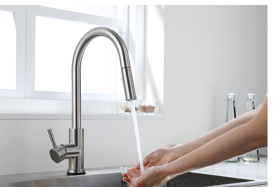 Smart Touch Kitchen Faucet with sensor technology, stainless steel finish, and pull-out spray feature, ideal for modern kitchens.