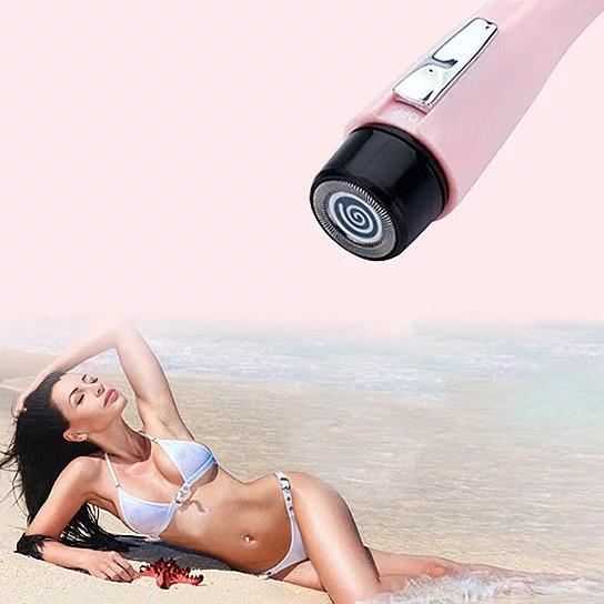 Smooth And Silky Ouchless Portable Ladies Hair Trimmer in pink, compact design with built-in light for precision trimming.