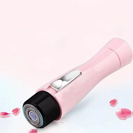 Smooth And Silky Ouchless Portable Ladies Hair Trimmer in pink, compact design with built-in light for precision trimming.