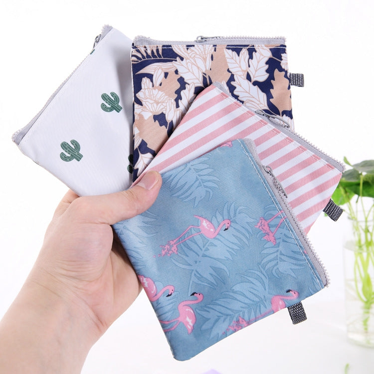 SN-031 Waterproof Zipper Sanitary Napkin Storage Bag in a stylish design, showcasing its compact size and zipper opening.