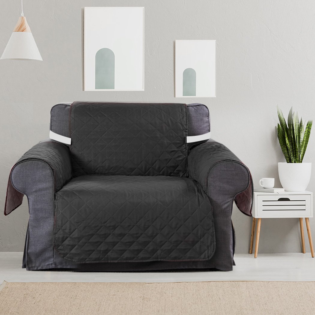 Grey quilted sofa cover protector, waterproof and stylish, designed for comfort and durability.