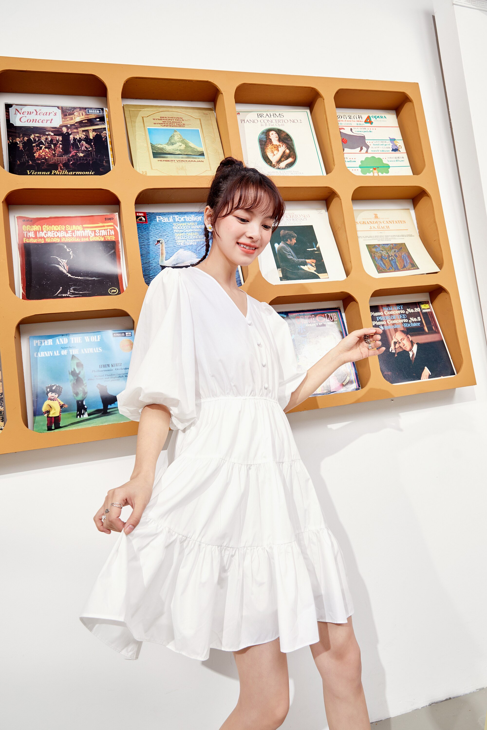 A stylish Solid Pure Casual Midi Ruffle Dress for women featuring vintage lantern sleeves, knee-length cut, and available in pink and white colors.