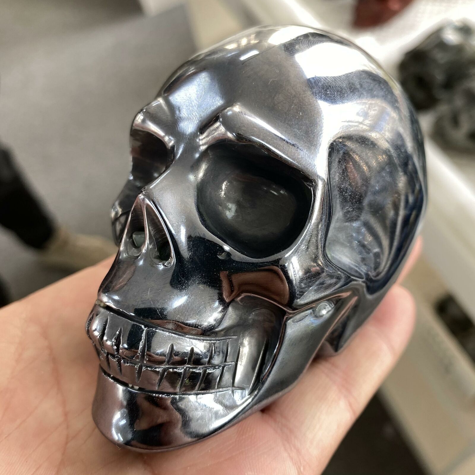 Hand-carved Solid Titanium Metal Skull showcasing intricate details and natural metallic finish, ideal for spiritual practices.