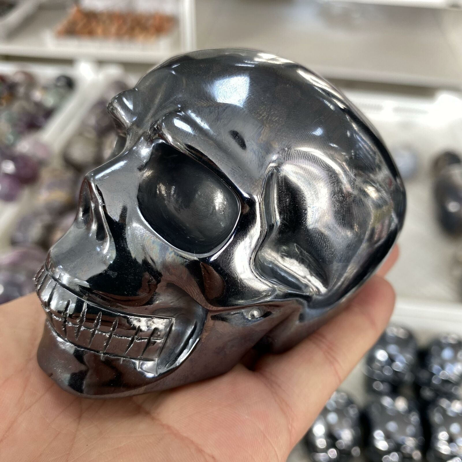 Hand-carved Solid Titanium Metal Skull showcasing intricate details and natural metallic finish, ideal for spiritual practices.