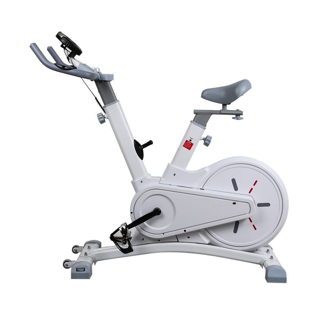 Spin Bike Magnetic Fitness Exercise Bike with adjustable seat and handlebars, digital monitor, and built-in wheels for easy transport.