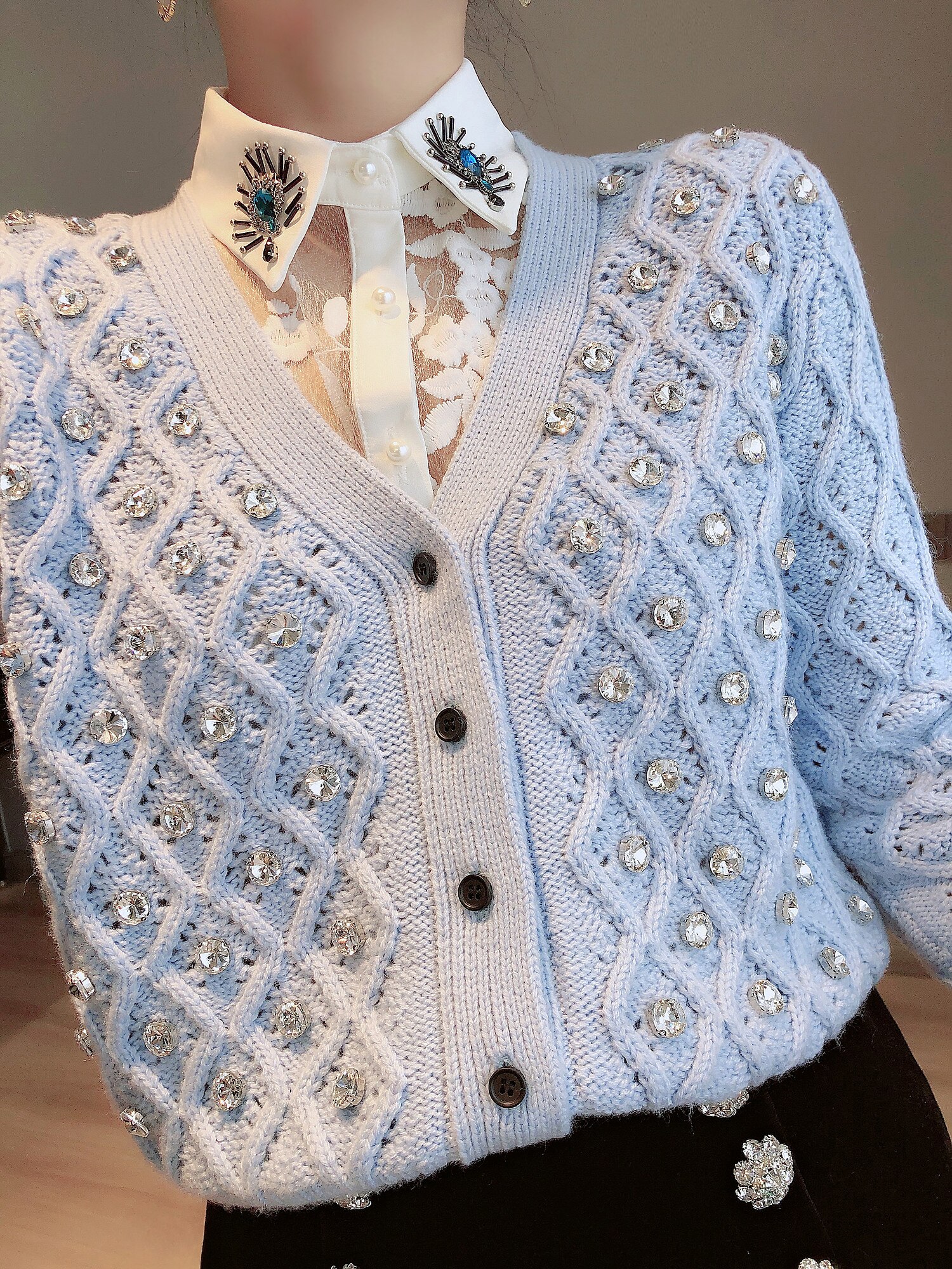 A stylish short women knit jacket featuring a V-neck, rhinestone details, and an argyle pattern, perfect for spring and autumn wear.