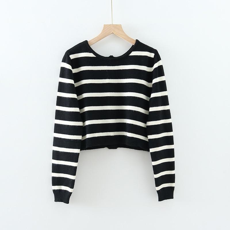 A stylish black and white striped cropped cardigan with long sleeves, perfect for casual spring and autumn wear.