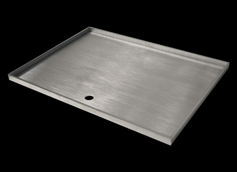 A high-quality stainless steel BBQ hot plate with folded sides and tapered drain hole, perfect for outdoor grilling.