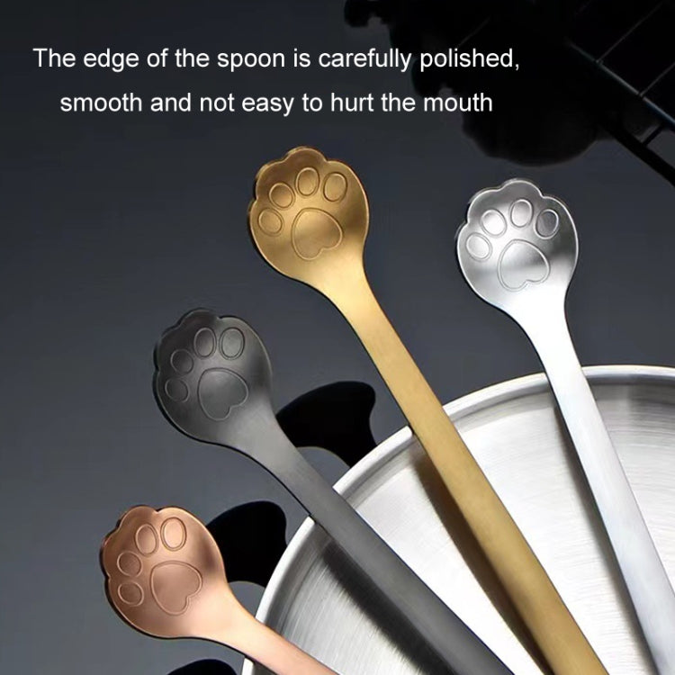 A stainless steel coffee stirring spoon designed like a cartoon cat paw, showcasing its polished finish and ergonomic handle.