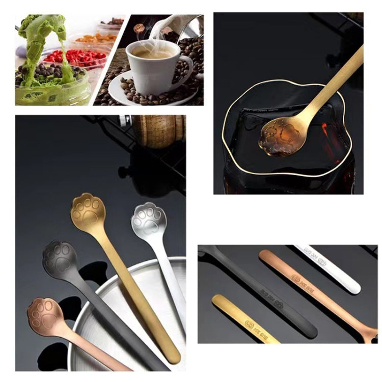 A stainless steel coffee stirring spoon designed like a cartoon cat paw, showcasing its polished finish and ergonomic handle.