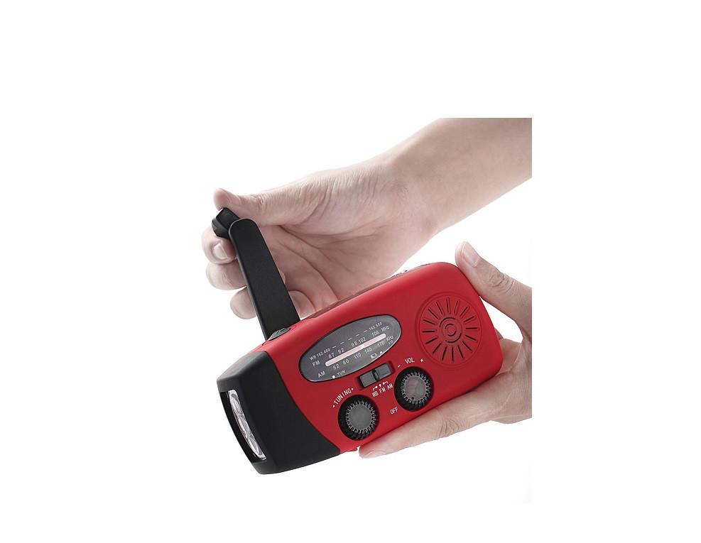 StormSafe Emergency Phone Charger with flashlight and weather radio, showcasing its compact design and multiple charging options.