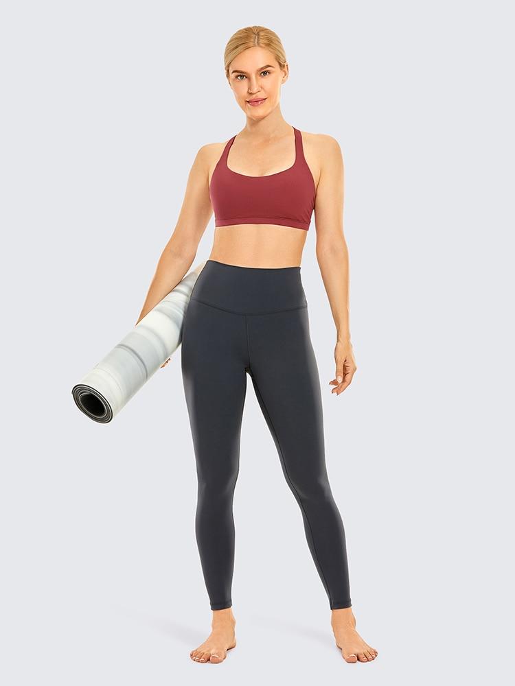 A stylish strappy sports bra for women featuring a cross-back design, padded support, and made from breathable fabric, ideal for yoga and fitness activities.