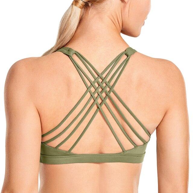 A stylish strappy sports bra for women featuring a cross-back design, padded support, and made from breathable fabric, ideal for yoga and fitness activities.