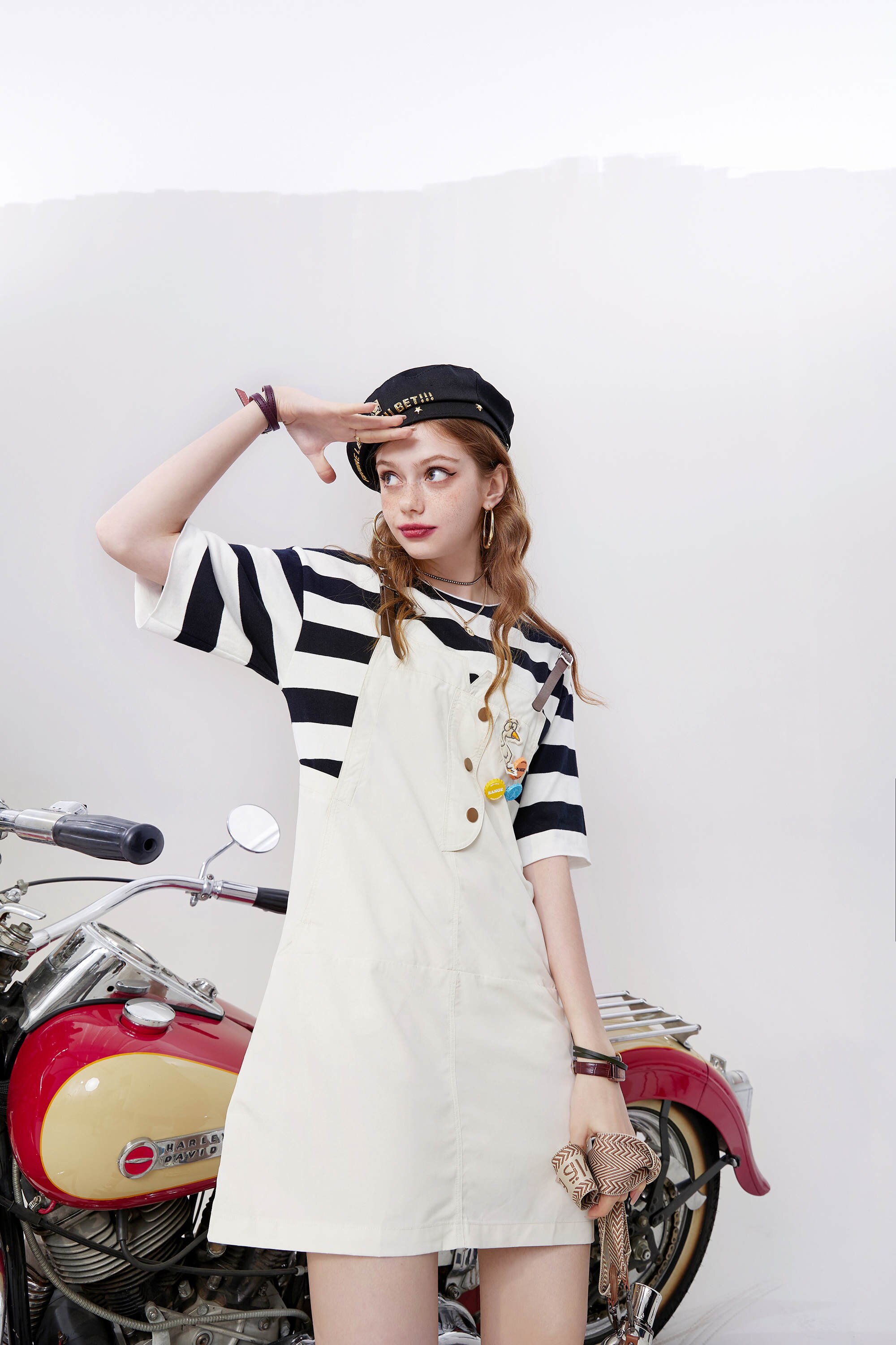 A stylish striped applique high waist casual vintage overall dress for women, featuring a V-neckline and knee-length cut, perfect for autumn wear.