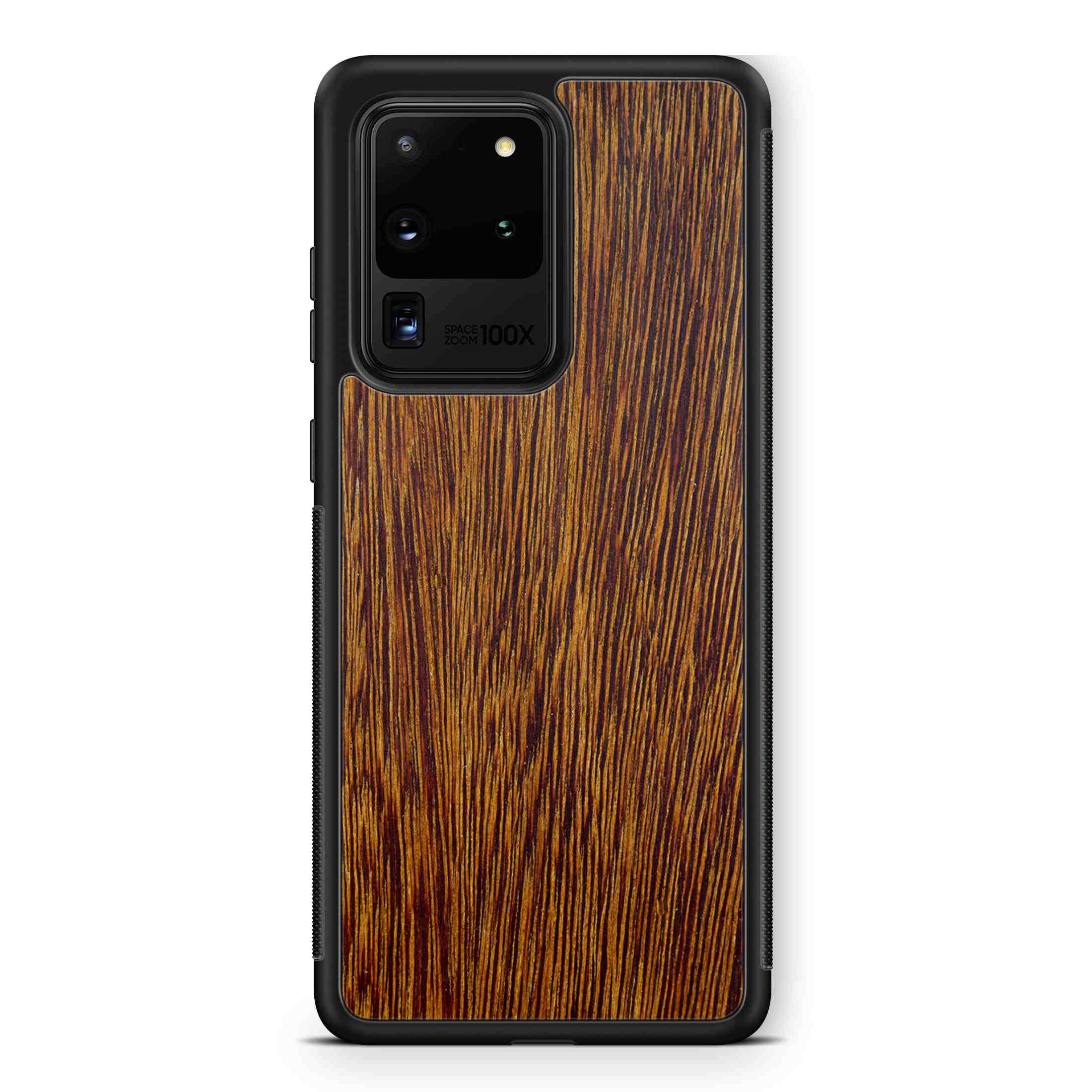 Sucupira wooden phone case held in hand, showcasing its unique grain and finish.