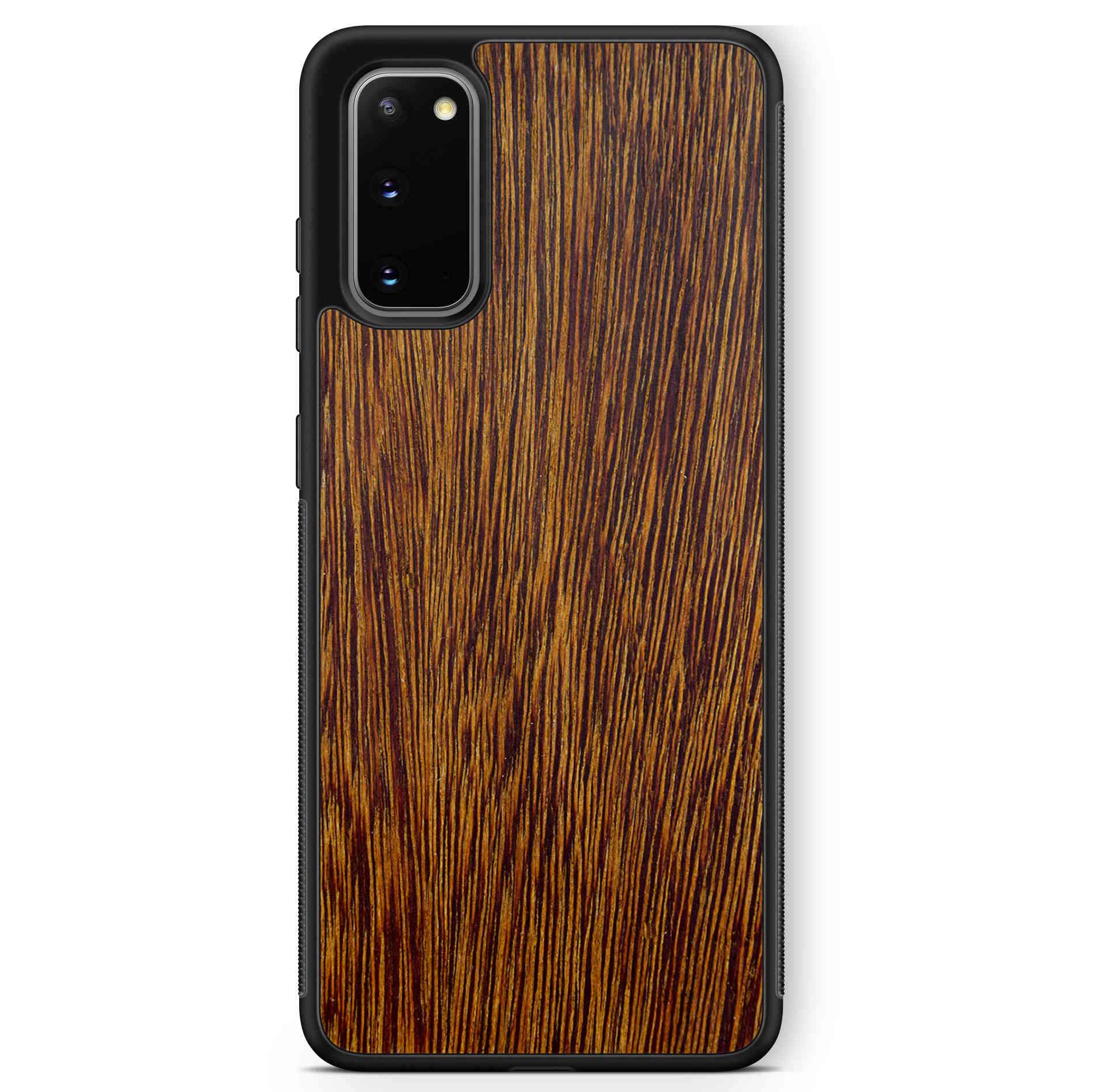 Sucupira wooden phone case held in hand, showcasing its unique grain and finish.