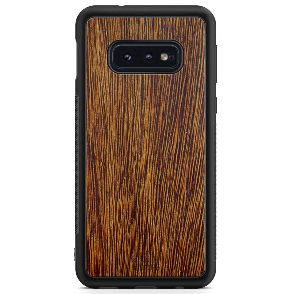 Sucupira wooden phone case held in hand, showcasing its unique grain and finish.