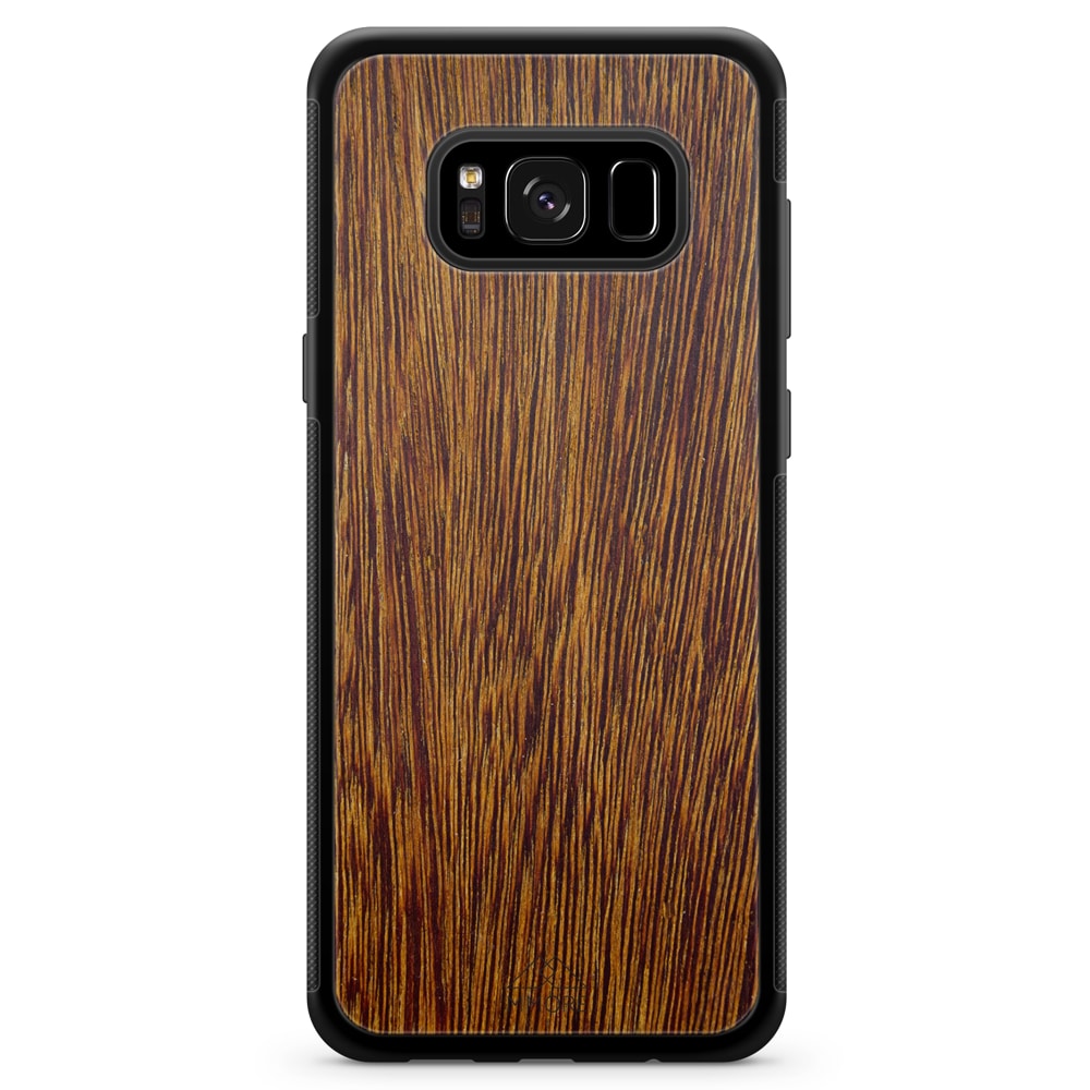 Sucupira wooden phone case held in hand, showcasing its unique grain and finish.