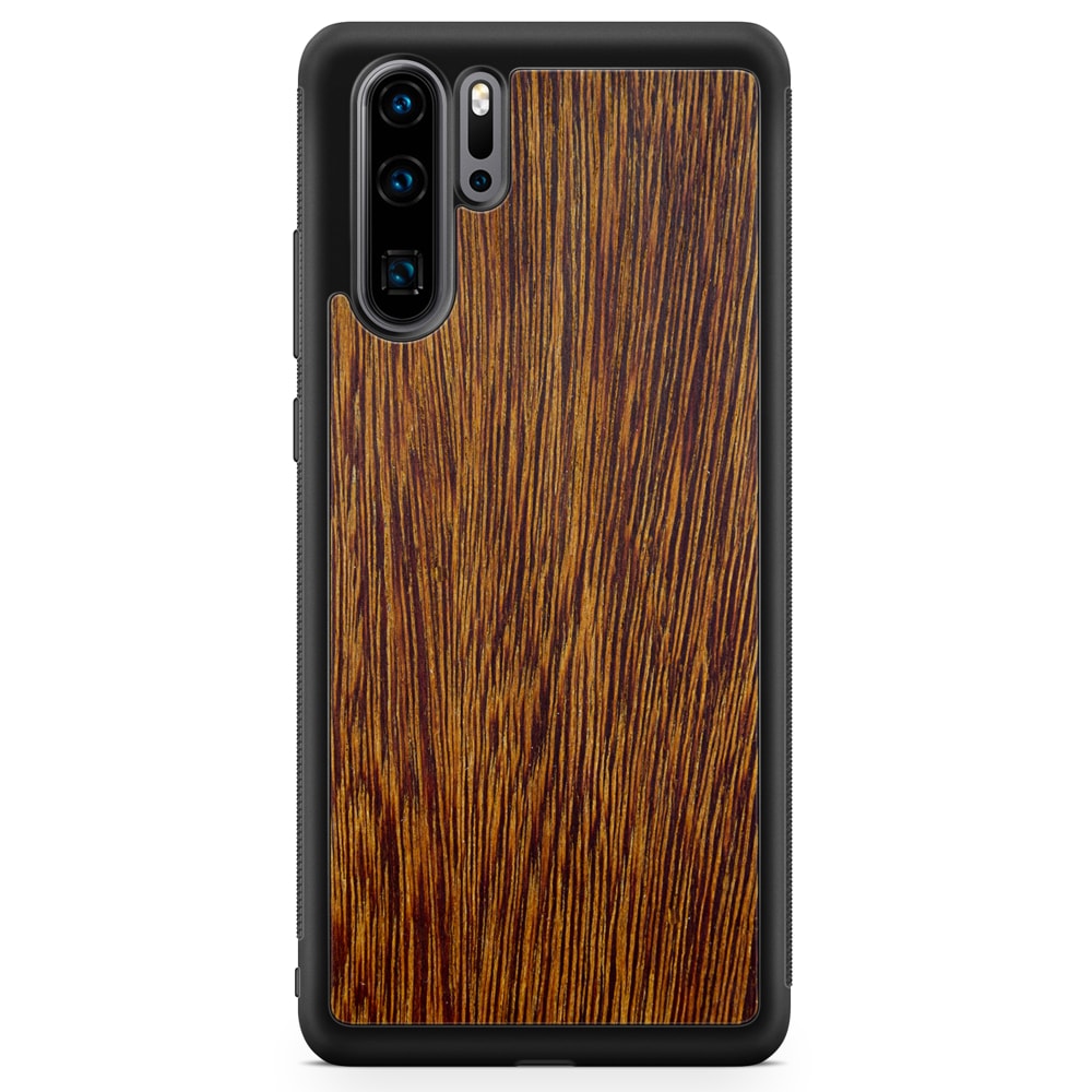 Sucupira wooden phone case held in hand, showcasing its unique grain and finish.