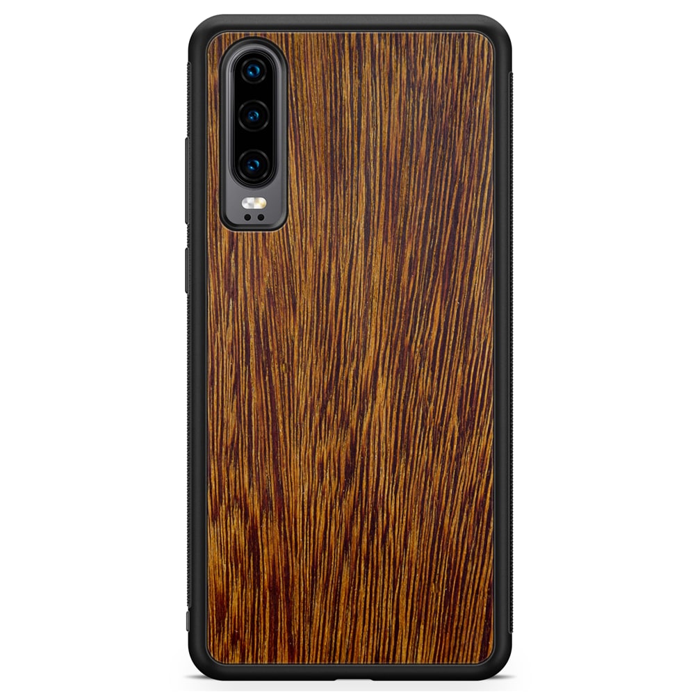 Sucupira wooden phone case held in hand, showcasing its unique grain and finish.